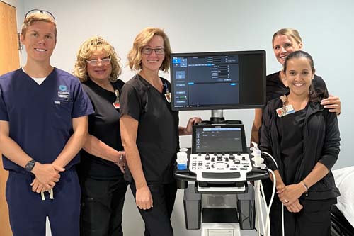 Picture of team with breast ultrasound tech